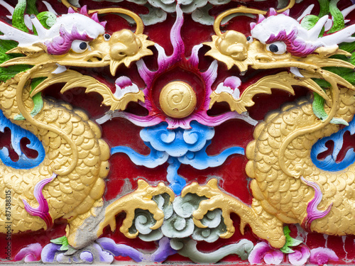 twin chinese dragon stucco, mirroring carved