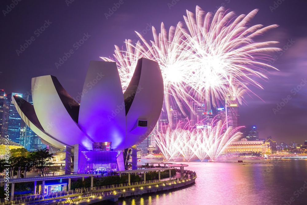 Fototapeta premium Singapore Skyline with fireworks at twilight