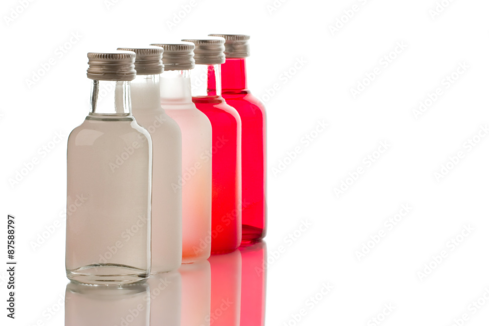 Back lit collection of colorful glass bottles - shallow focus Back lit collection of colorful glass bottles - shallow focus