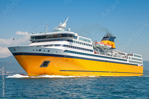 Big yellow passenger ferry goes on the Sea Fototapeta