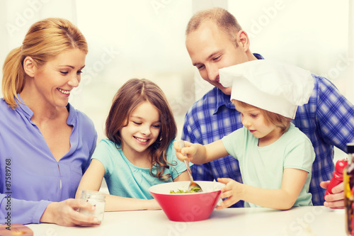 happy family with two kids eating at home