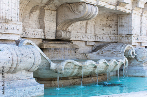 Marble fountain with clear blue water in Rome, Italy photo
