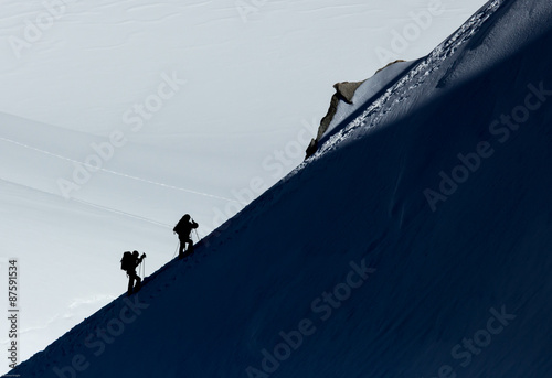 Mountaineers climbing in snow