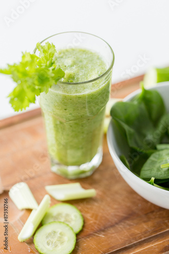 close up of fresh green juice glass and celery