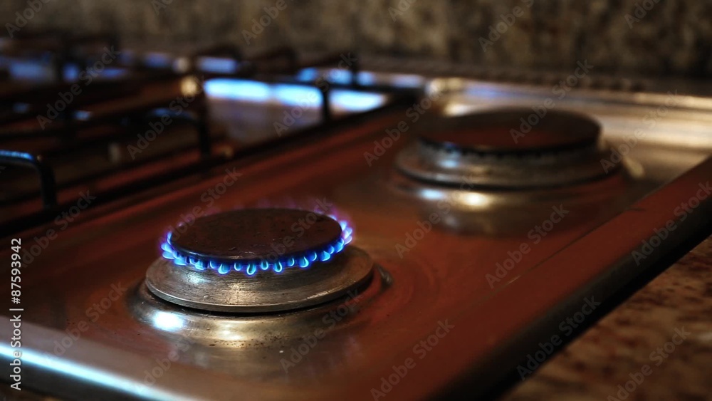 Ignite on gas stove at the kitchen, closeup
Ignite on gas stove at the kitchen, closeup