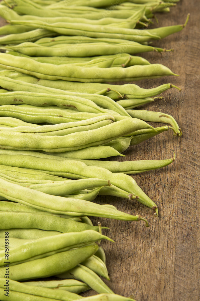 small and slender green beans (haricot vert) on a wood small and slender green beans (haricot vert) on a wood