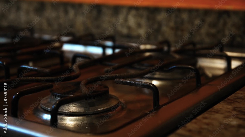 Ignite on gas stove at the kitchen, closeup
