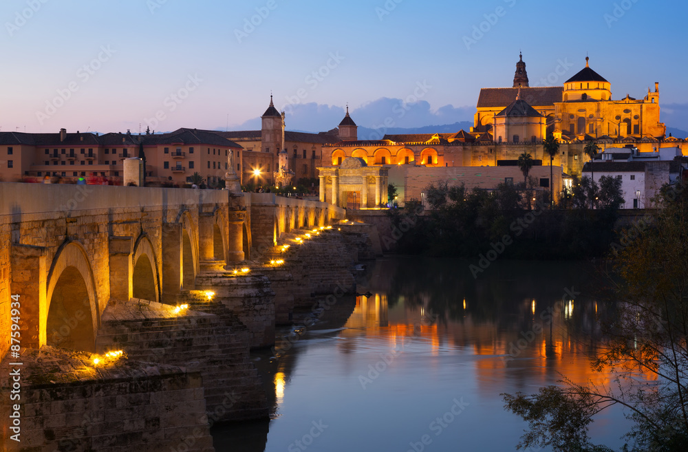 Cathedral of Cordoba and Roman bridge in evening