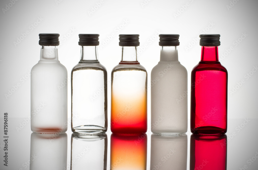 Back lit collection of colorful glass bottles Back lit collection of colorful glass bottles
