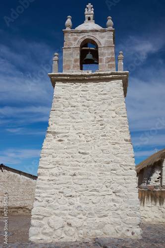 Historic church in the small village of Guallatire on the Altiplano in the Arica y Parinacota Region of Chile. The village sits at the base of the active Guallatire Volcano. photo