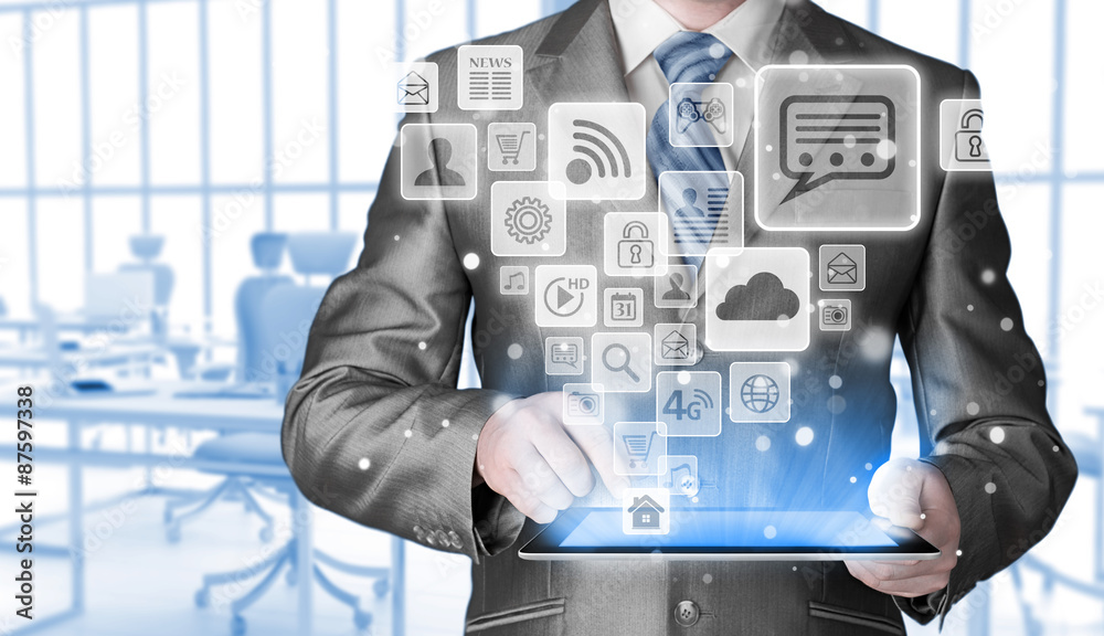 Business man using tablet PC with social media icon set Business man using tablet PC with social media icon set