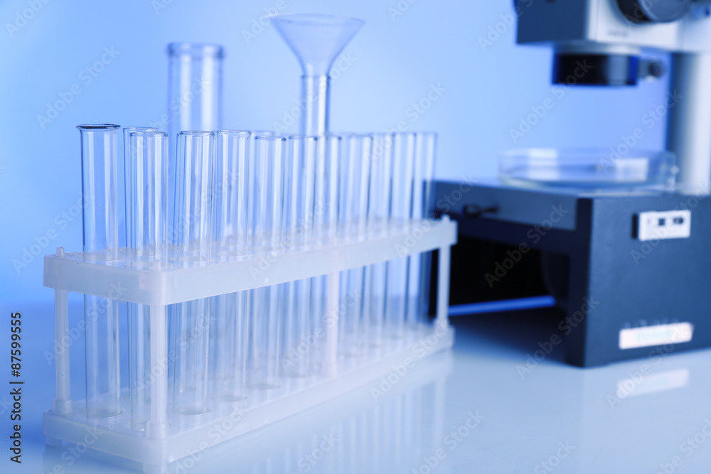 Naklejka premium Test tubes and microscope in laboratory