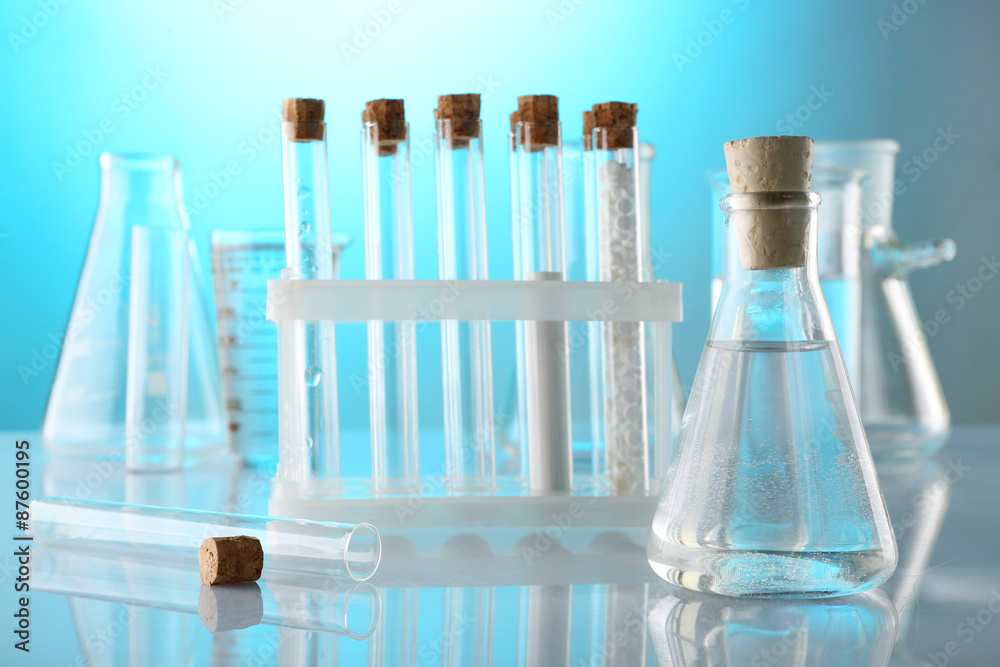 Empty laboratory test tubes on blue background Empty laboratory test tubes on blue background