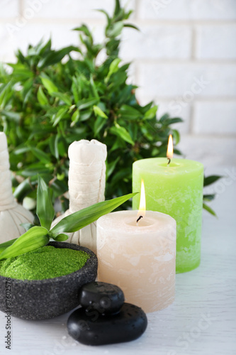 Beautiful composition of spa treatment on white wooden table