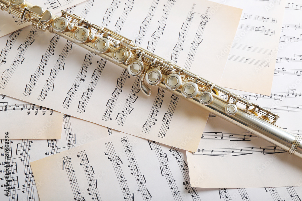 Fototapeta premium Flute on music notes background