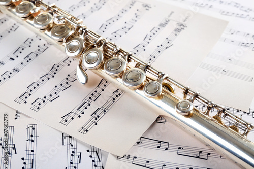Fotografija Flute on music notes background