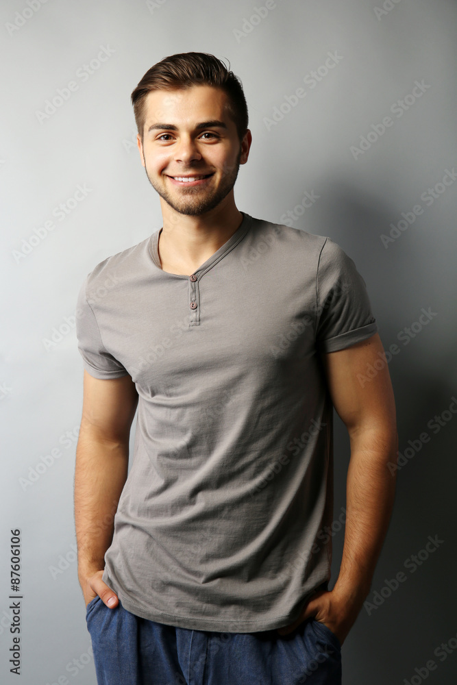 Handsome man on gray background Handsome man on gray background