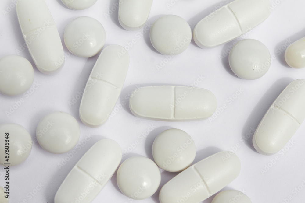 white pills /medicine / capsules close up on white background white pills /medicine / capsules close up on white background