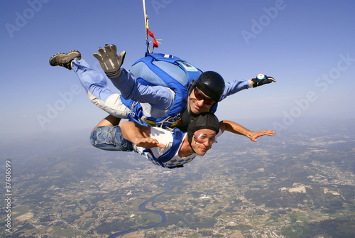 Skydiving tandem father and son