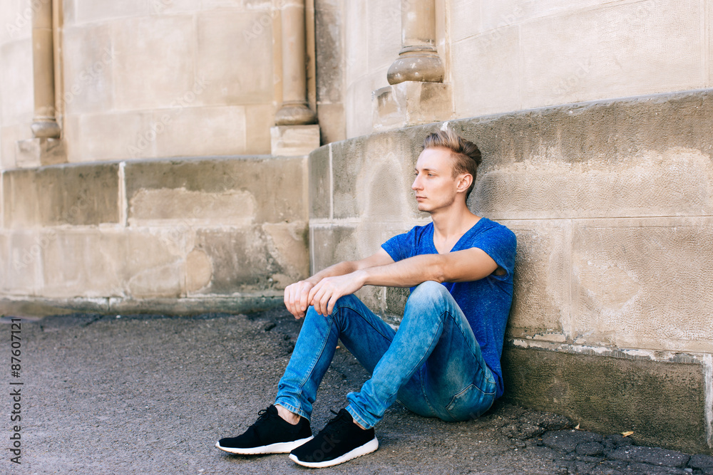 Attractive blue eyed, blond young man on the street Attractive blue eyed, blond young man on the street