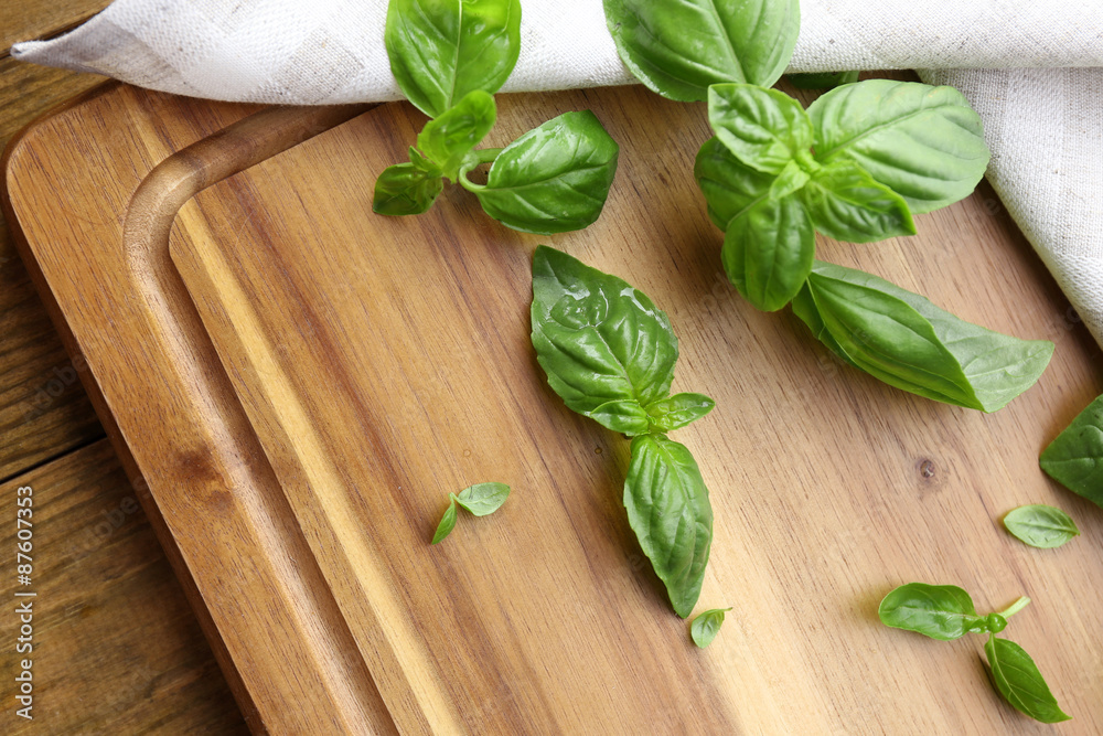 Green fresh basil with napkin on table close up Green fresh basil with napkin on table close up