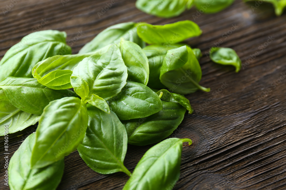 Green fresh basil on wooden background Green fresh basil on wooden background
