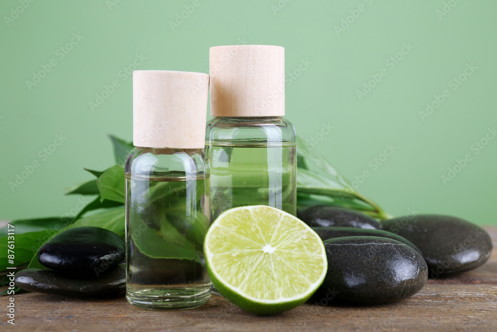 Spa still life in green color on wooden table on green background Spa still life in green color on wooden table on green background
