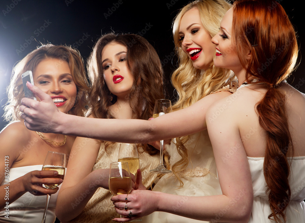party  girls clinking flutes with sparkling wine