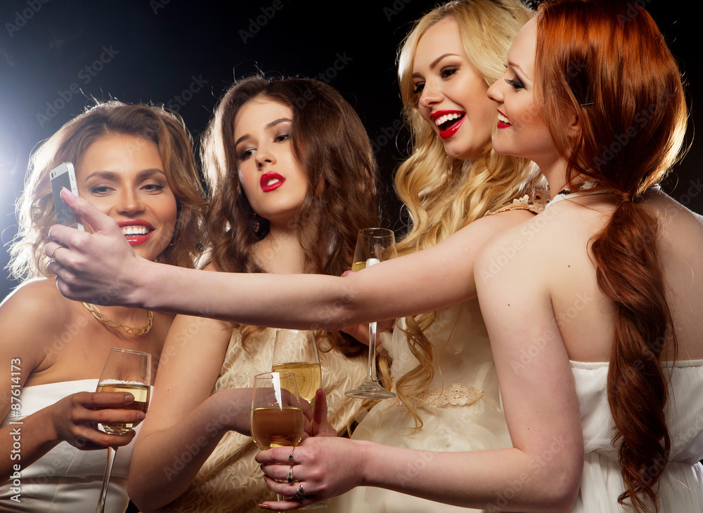 party girls clinking flutes with sparkling wine party girls clinking flutes with sparkling wine