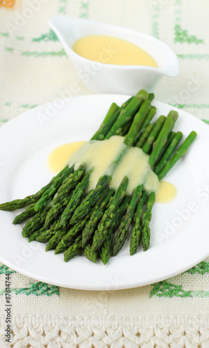 freshly cooked green asparagus with hollandaise sauce