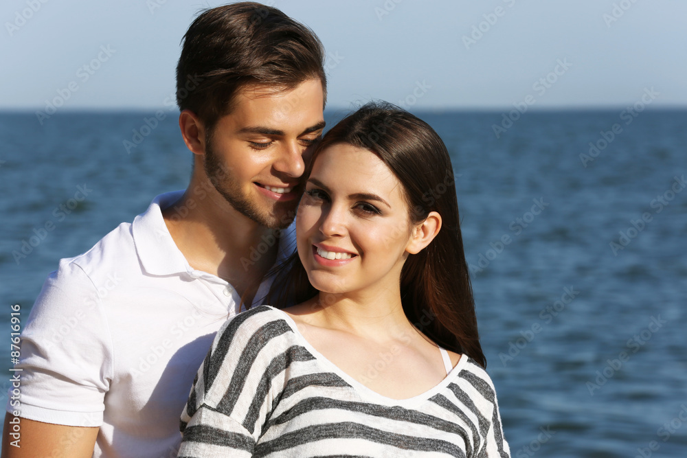 Beautiful young couple on beach Beautiful young couple on beach