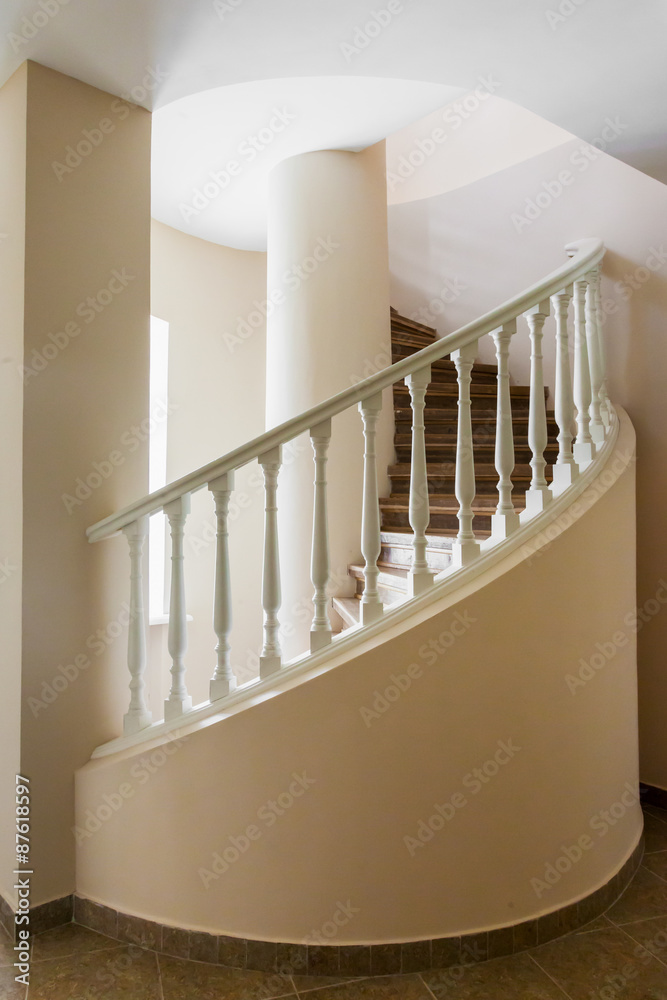 Naklejka premium Spiral stairs in old manor