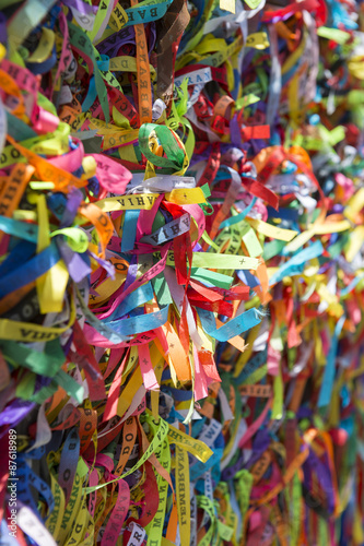 Colorful Brazilian wish ribbons tied to a fence at the Bonfim Church Salvador Bahia Brazil 