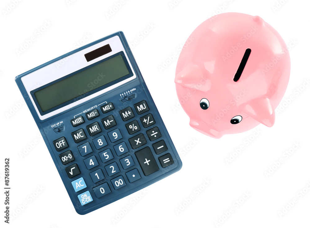 Piggy bank with calculator isolated on white Piggy bank with calculator isolated on white