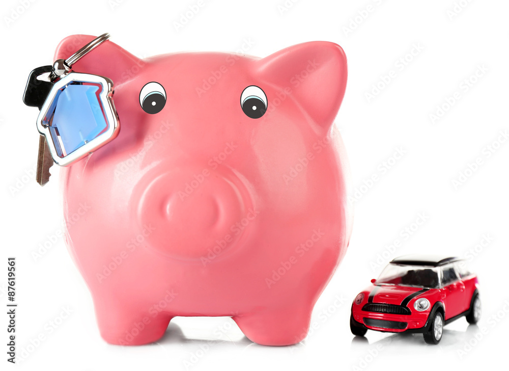 Piggy bank with toy car and key isolated on white Piggy bank with toy car and key isolated on white