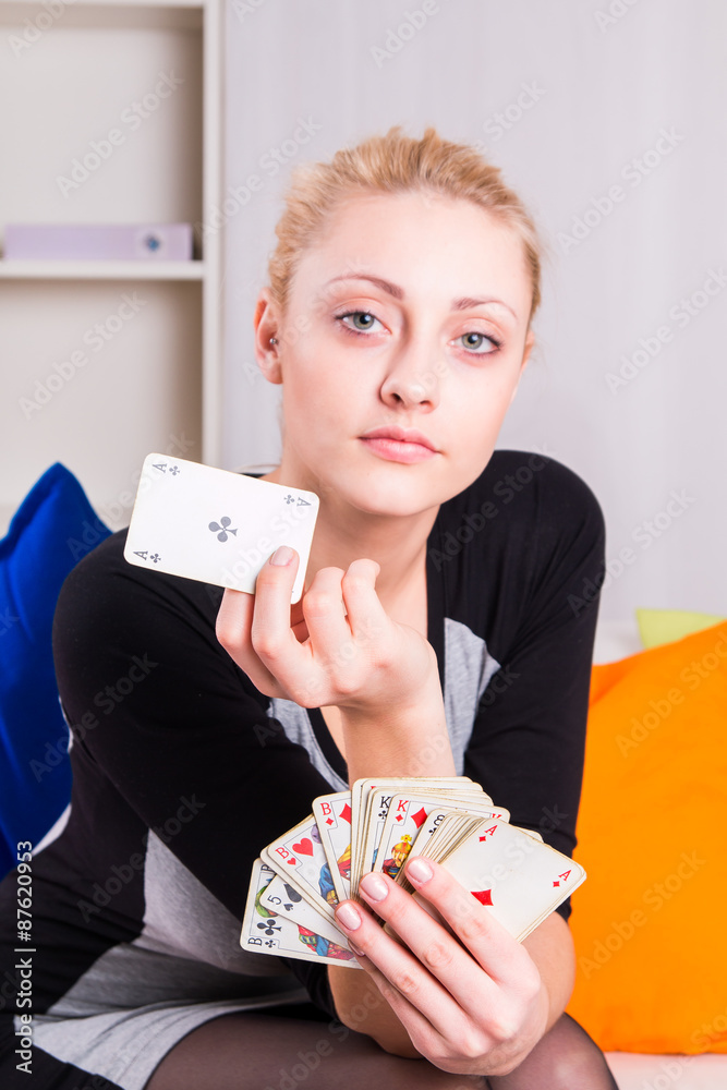 Portrait of a girl playing cards at home Portrait of a girl playing cards at home