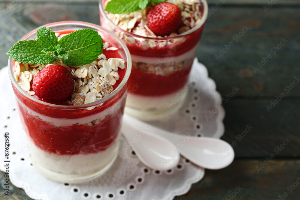 Dessert with fresh strawberry, cream and granola, on wooden table background Dessert with fresh strawberry, cream and granola, on wooden table background