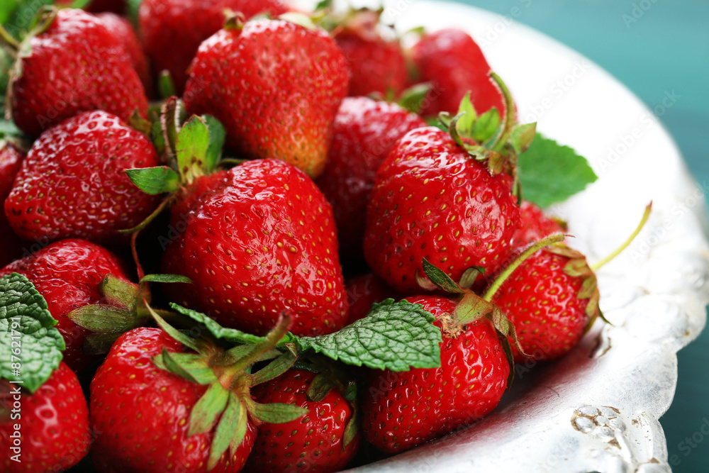 Red ripe strawberries on tray, on color wooden background Red ripe strawberries on tray, on color wooden background