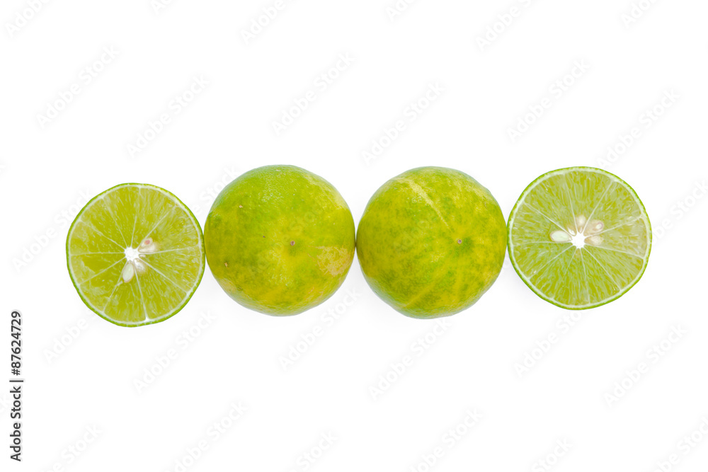 Juicy slices of lime isolated on white background.