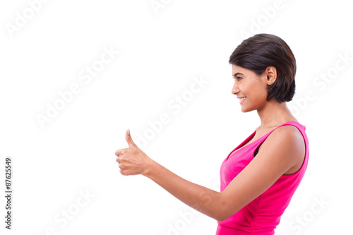 asian woman giving thumb up gesture, isolated on white backgroun