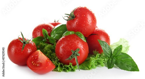 Cherry tomatoes with basil and lettuce close up