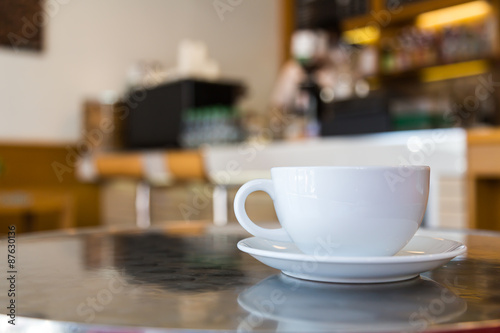 Coffee cup on table in cafe