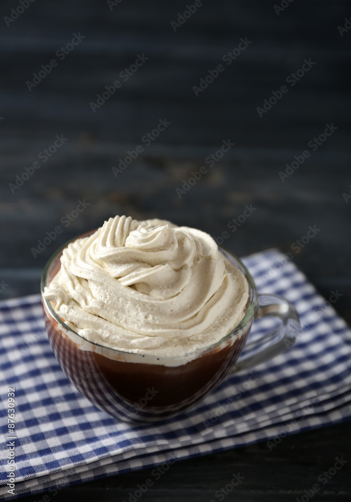 Cup of coffee with cream on color wooden background Cup of coffee with cream on color wooden background