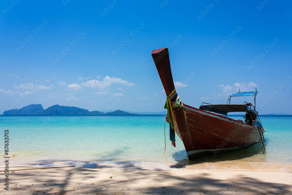 Boat on the beach and blue sky