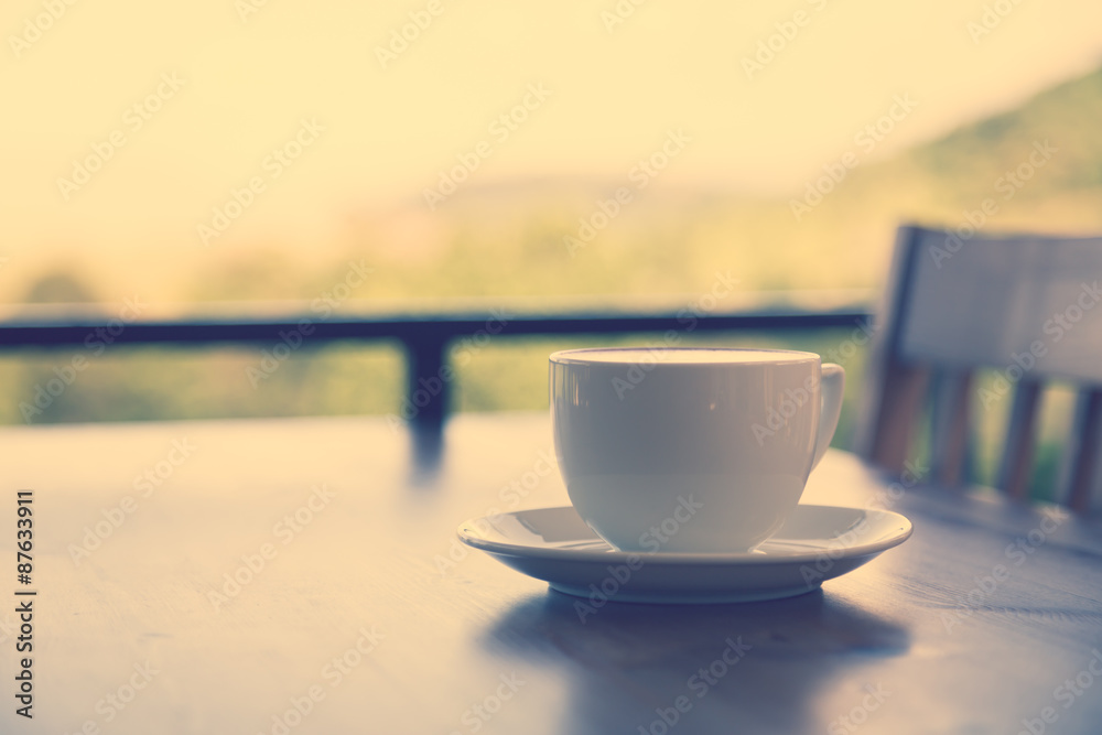 Coffee in white cup on wood table ( Filtered image processed vin