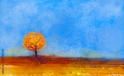 Abstract landscape, tree and field oil painting. Yellow,orange,red color and blue sky of falling season