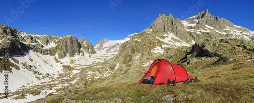 Panorama of the Alps in canton Uri, Switzerland, with a tent.