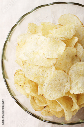Delicious potato chips in bowl