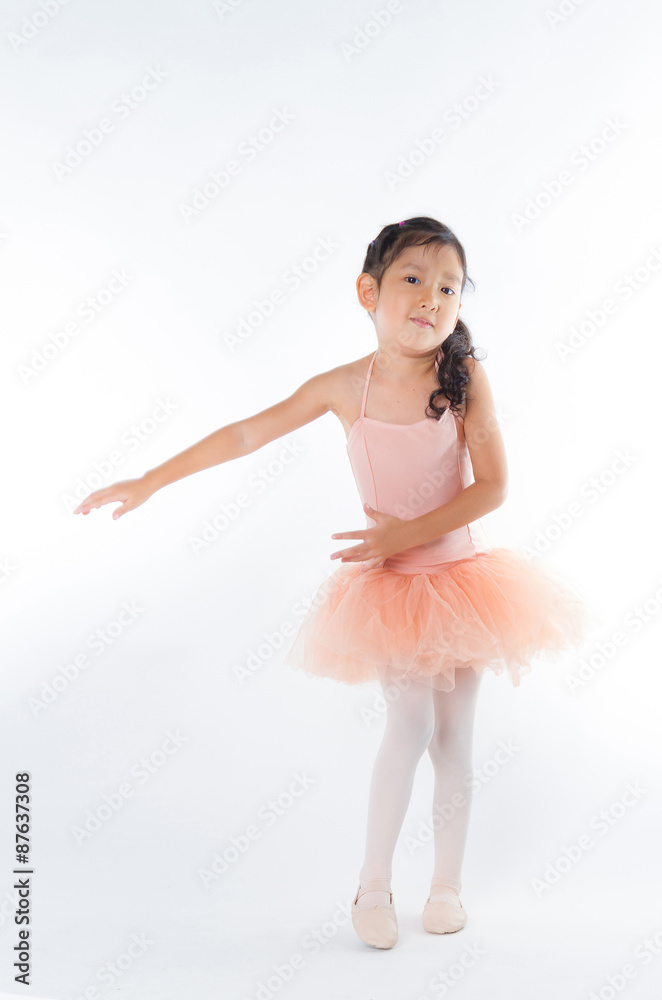 Naklejka premium A little ballerina in the studio. On White Background
