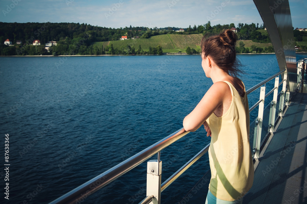 Fototapeta premium Young girl enjoying view of the Bodensee on the ferry, lake Constance